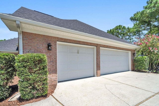 garage with concrete driveway