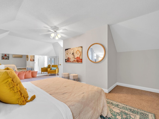 bedroom featuring a textured ceiling, carpet floors, a ceiling fan, baseboards, and vaulted ceiling