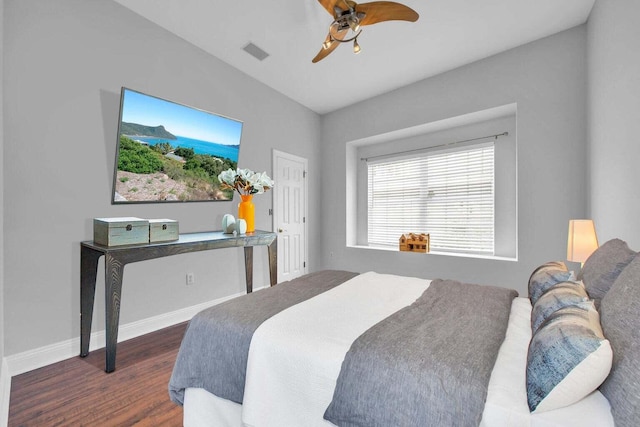 bedroom with a ceiling fan, dark wood-style flooring, visible vents, and baseboards