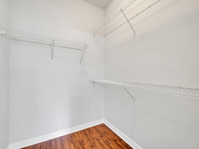 spacious closet with wood finished floors