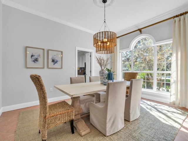 dining area with baseboards, an inviting chandelier, tile patterned floors, and crown molding