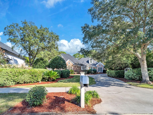 view of front of property featuring driveway and a residential view