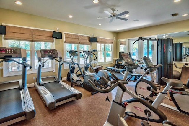 workout area featuring recessed lighting, a ceiling fan, baseboards, visible vents, and french doors