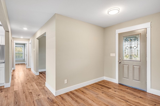 foyer entrance with light hardwood / wood-style floors