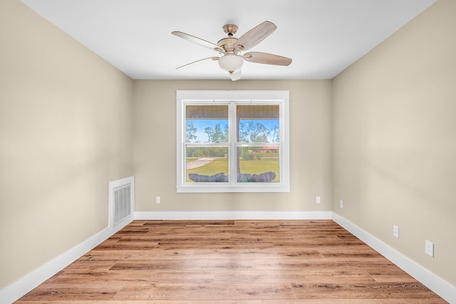 spare room with ceiling fan and light hardwood / wood-style floors