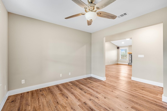 empty room featuring light hardwood / wood-style flooring and ceiling fan