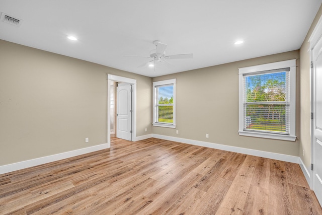 unfurnished room with ceiling fan and light hardwood / wood-style flooring