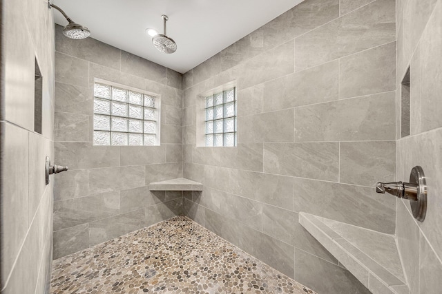 bathroom with a tile shower