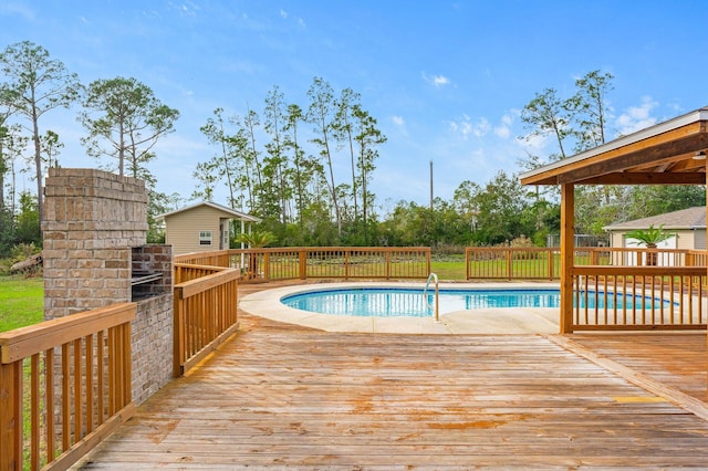 view of swimming pool with a deck