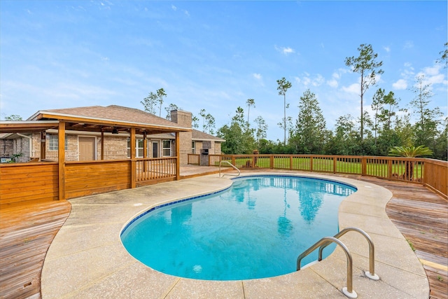 view of pool with a wooden deck