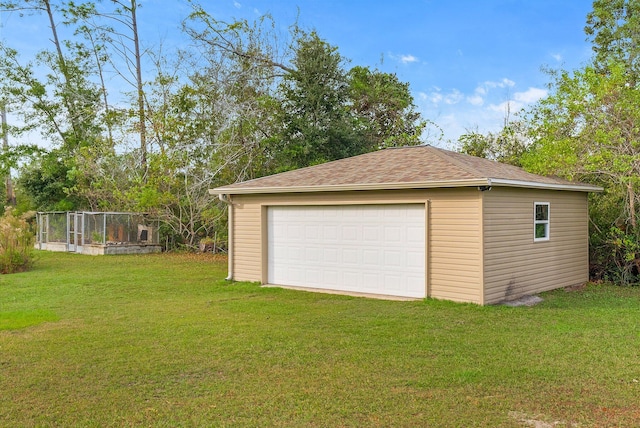 garage featuring a lawn