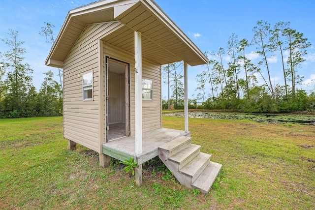 view of outbuilding with a yard