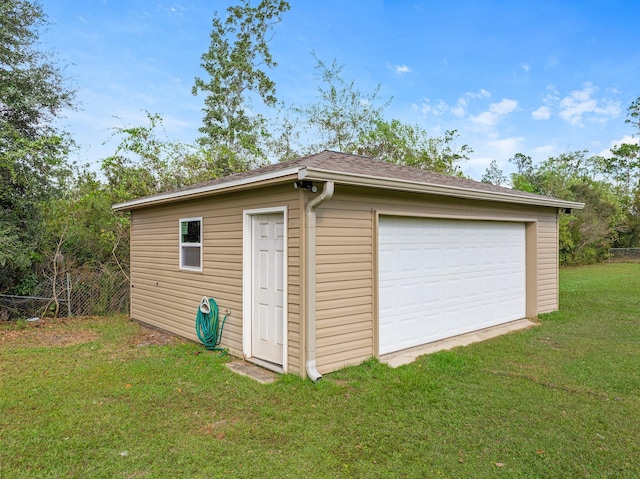 garage with a yard