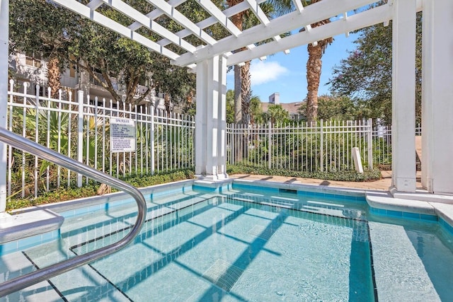 view of swimming pool with a pergola