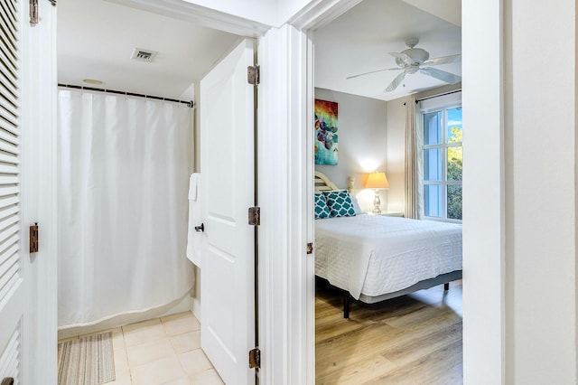 bedroom with light wood-type flooring and ceiling fan