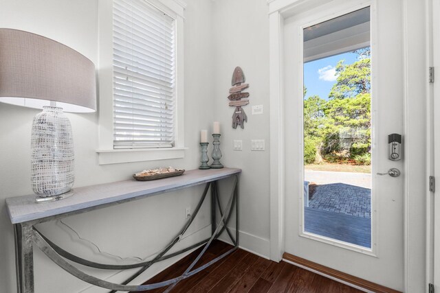 82 Gulfview Way, Santa Rosa Beach, FL 32459 - doorway to outside featuring dark wood-type flooring and baseboards