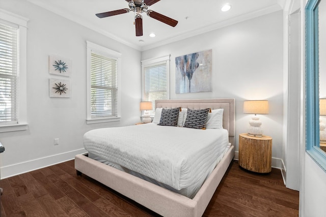 bedroom with multiple windows, ceiling fan, and dark wood-type flooring