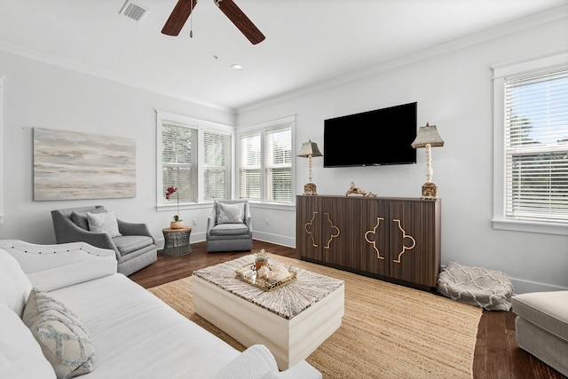 living room featuring ceiling fan, ornamental molding, and hardwood / wood-style flooring