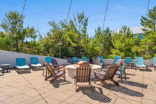 view of patio featuring a fire pit