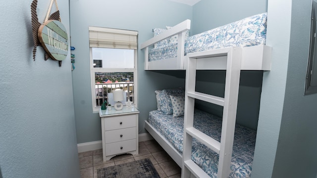 bedroom featuring light tile patterned floors