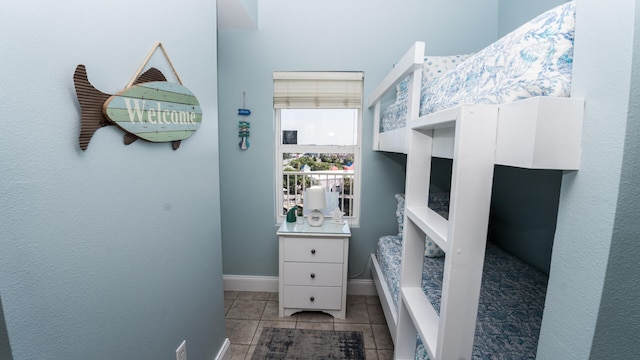 bedroom featuring light tile patterned floors