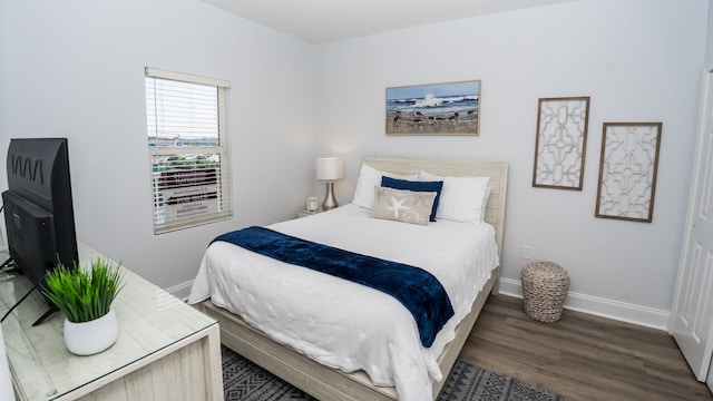 bedroom featuring dark hardwood / wood-style floors