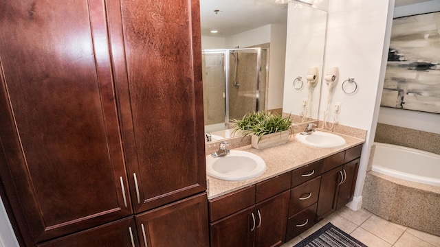 bathroom featuring tile patterned flooring, vanity, and independent shower and bath