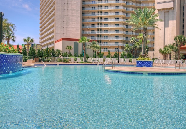 view of swimming pool featuring pool water feature