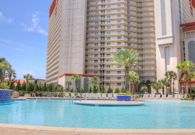 view of pool with pool water feature