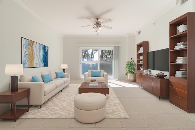 living room featuring light tile patterned flooring, baseboards, visible vents, ceiling fan, and ornamental molding
