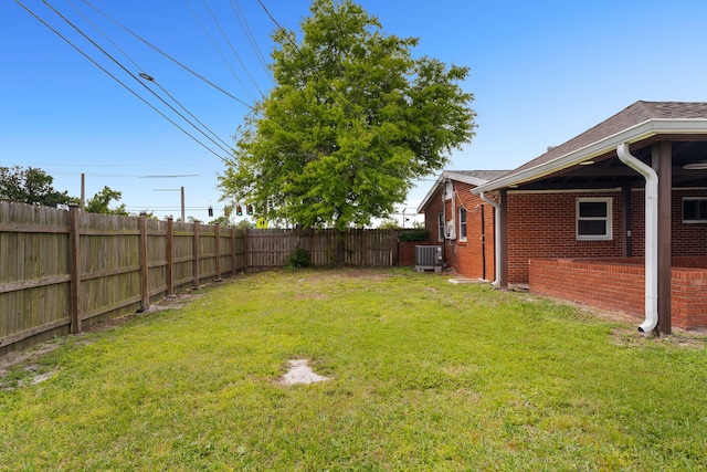 view of yard with central air condition unit