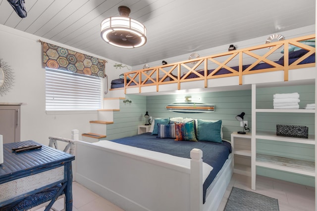 bedroom with wood ceiling and tile patterned floors