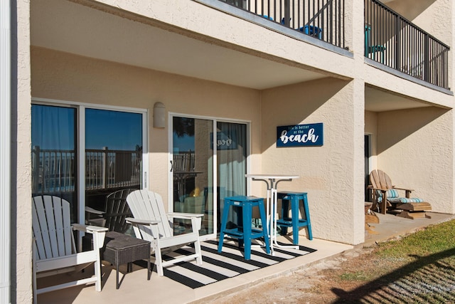 view of patio with a balcony