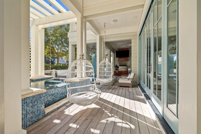 wooden deck with a grill and french doors