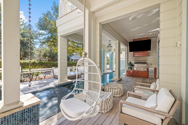 deck featuring area for grilling and a grill