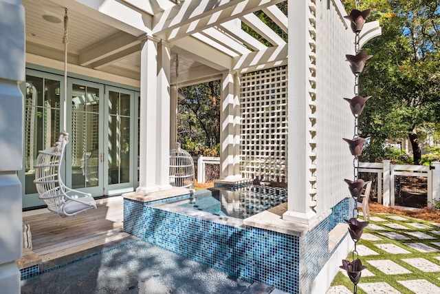 view of patio featuring a pergola, a hot tub, and a deck