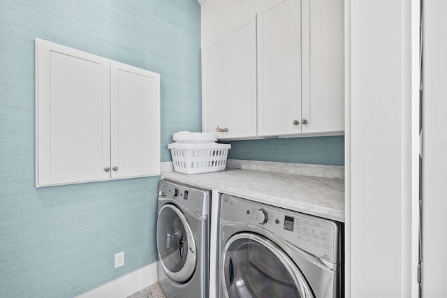 laundry area featuring cabinets and independent washer and dryer