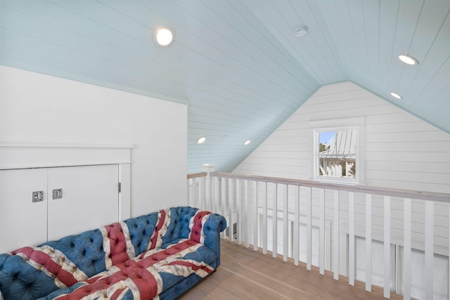 sitting room featuring hardwood / wood-style flooring, wood ceiling, and vaulted ceiling