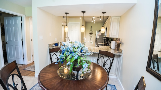 dining area featuring light wood-type flooring