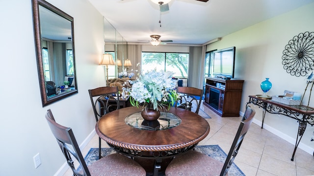 dining room featuring light tile patterned floors and ceiling fan