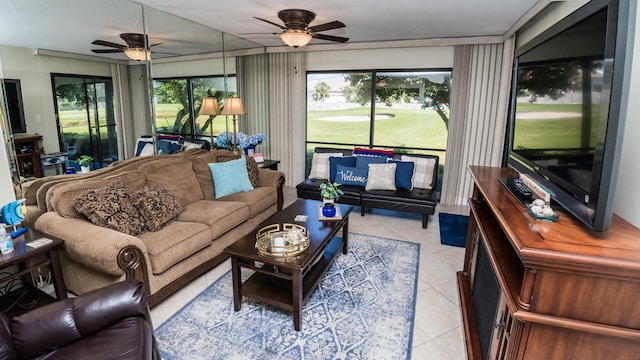 living room with ceiling fan and light tile patterned floors