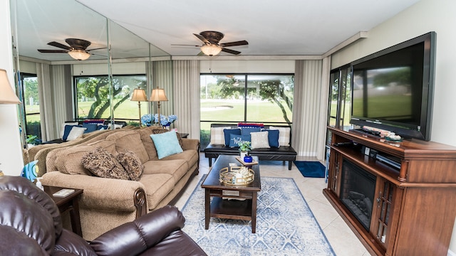 living room featuring light tile patterned floors and ceiling fan