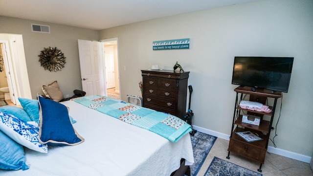 bedroom featuring ensuite bathroom