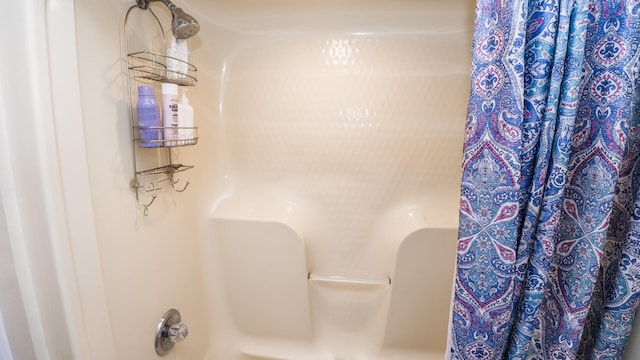 bathroom featuring curtained shower