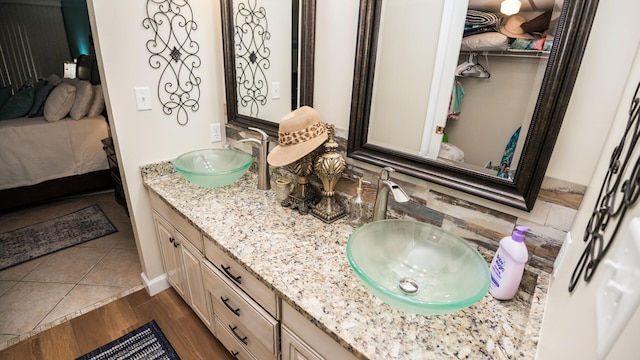 bathroom featuring vanity and wood-type flooring