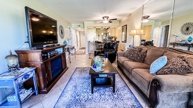 living room with tile patterned floors and ceiling fan