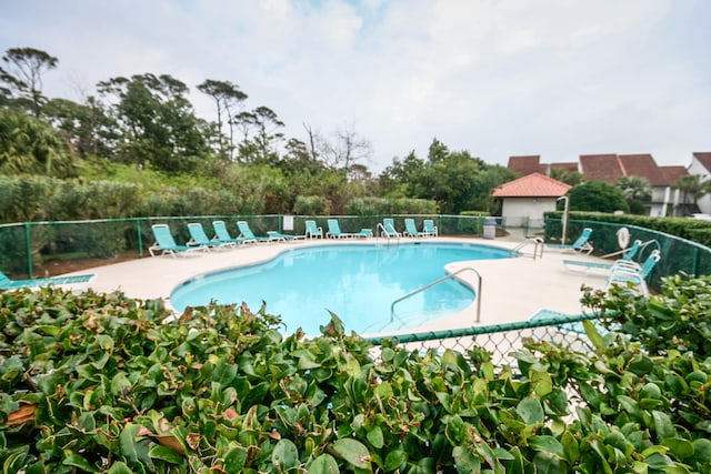 view of swimming pool with a patio area