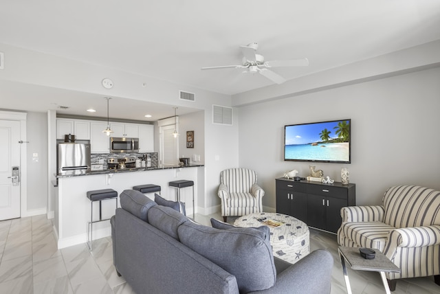 living room with ceiling fan