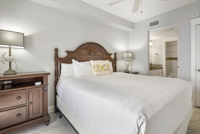 bedroom with ensuite bathroom and ceiling fan