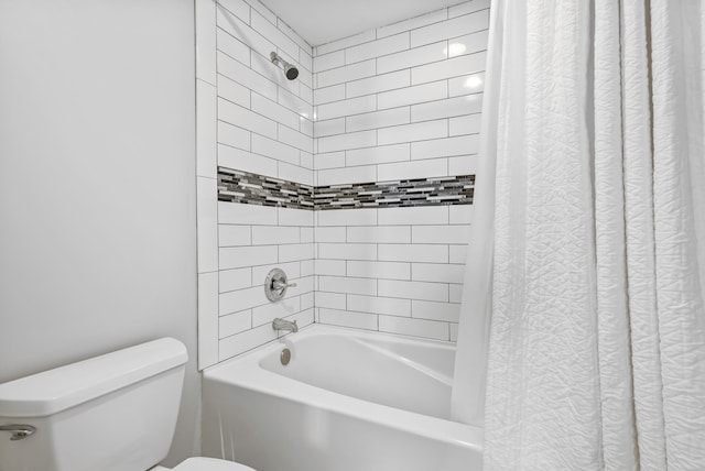 bathroom with toilet and shower / bath combo with shower curtain